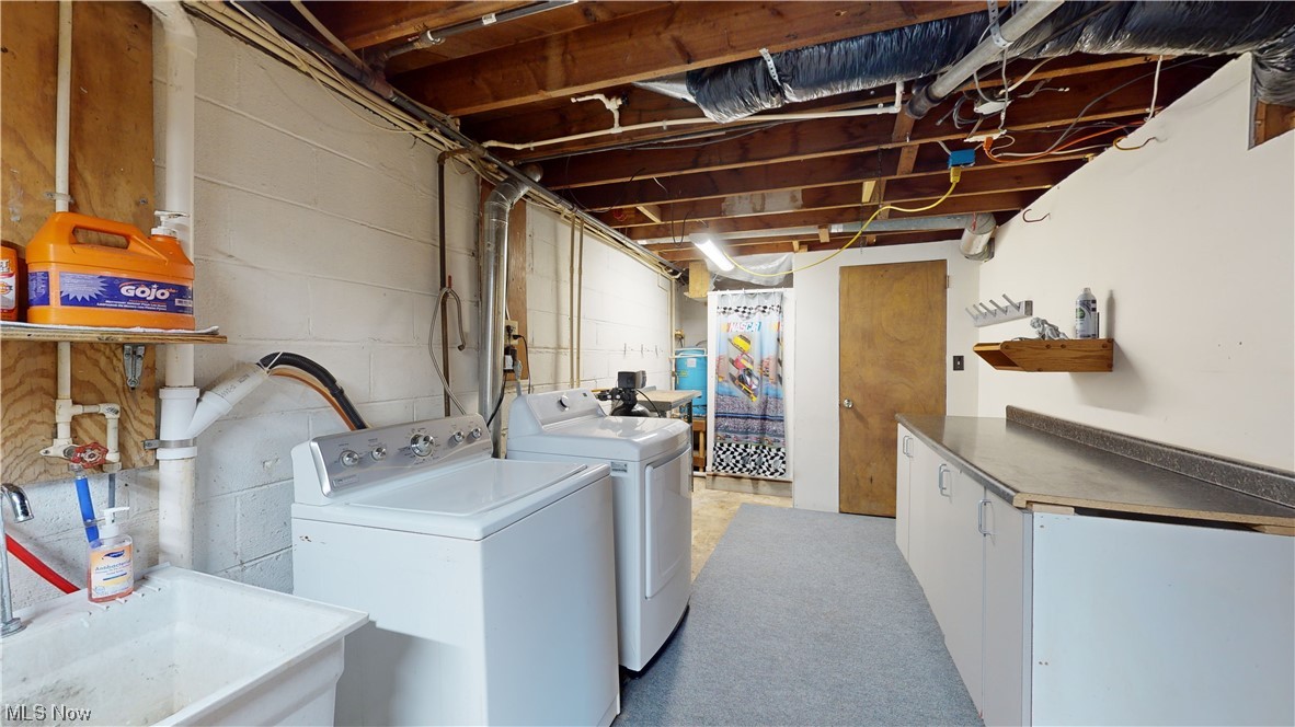 6755 State Rte 5 Ravenna, OH 44266 - Photo 27 of 34 Washroom featuring cabinets and washing machine and dryer