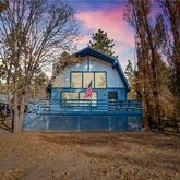 a view of house with outdoor space and trees around