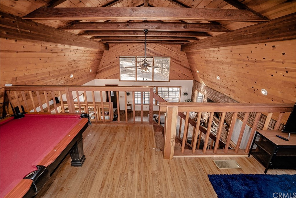 725 Temple Lane Big Bear Lake, CA 92315 - Photo 13 of 65 a view of a balcony with furniture and a potted plant