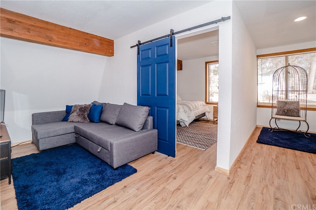 725 Temple Lane Big Bear Lake, CA 92315 - Photo 16 of 65 a living room with furniture and a wooden floor