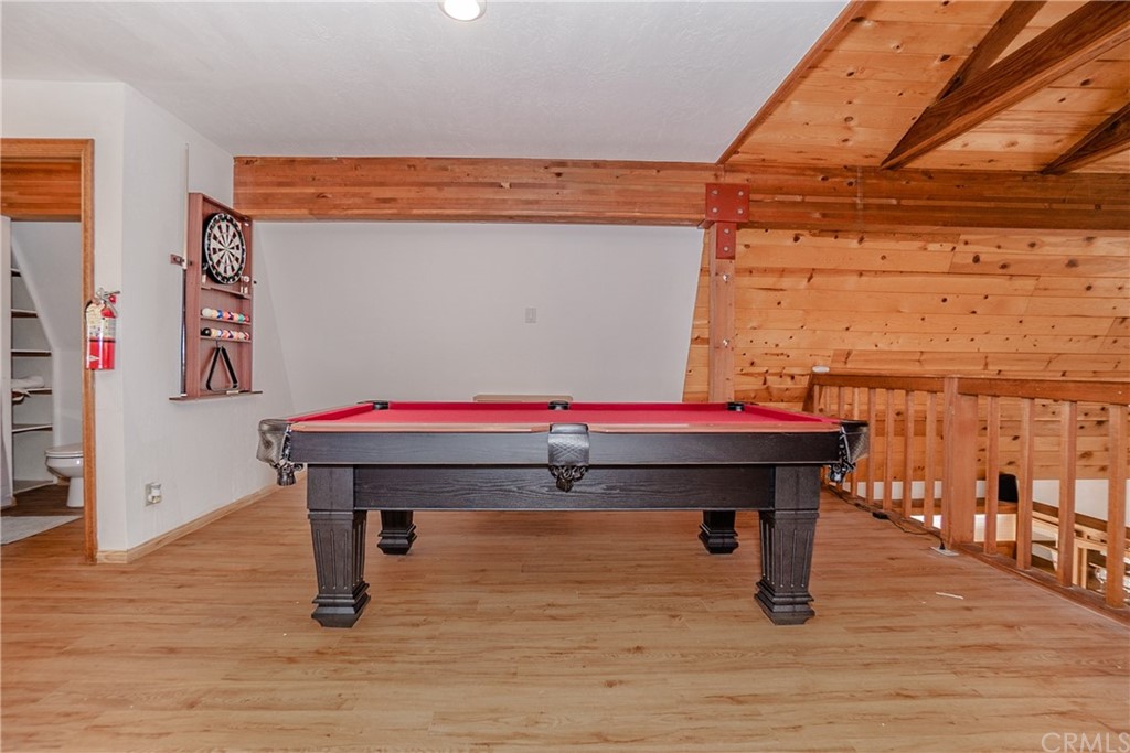 725 Temple Lane Big Bear Lake, CA 92315 - Photo 18 of 65 a room with table chair and wooden floor