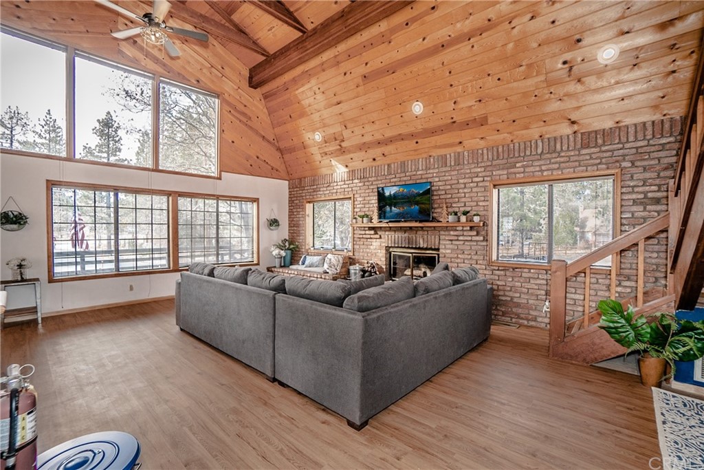 725 Temple Lane Big Bear Lake, CA 92315 - Photo 27 of 65 a living room with furniture and a large window