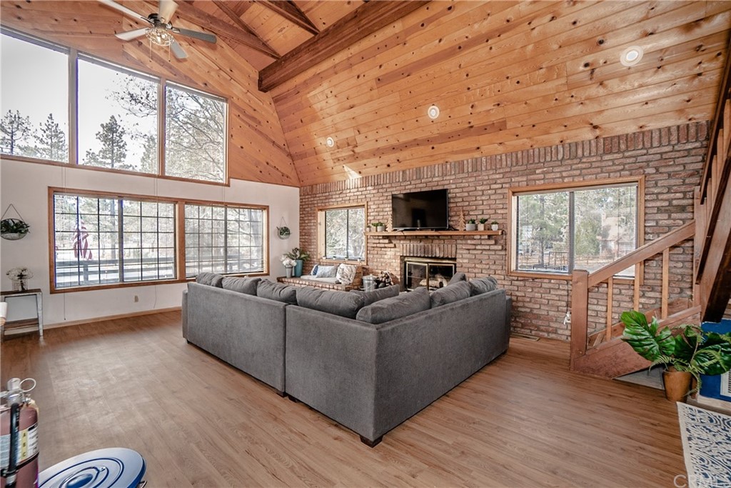 725 Temple Lane Big Bear Lake, CA 92315 - Photo 28 of 65 a living room with furniture and a flat screen tv