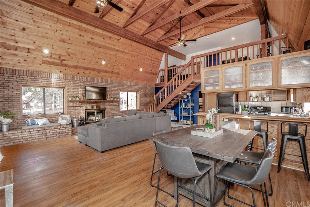 725 Temple Lane Big Bear Lake, CA 92315 - Photo 36 of 65 a dining room with furniture and wooden floor