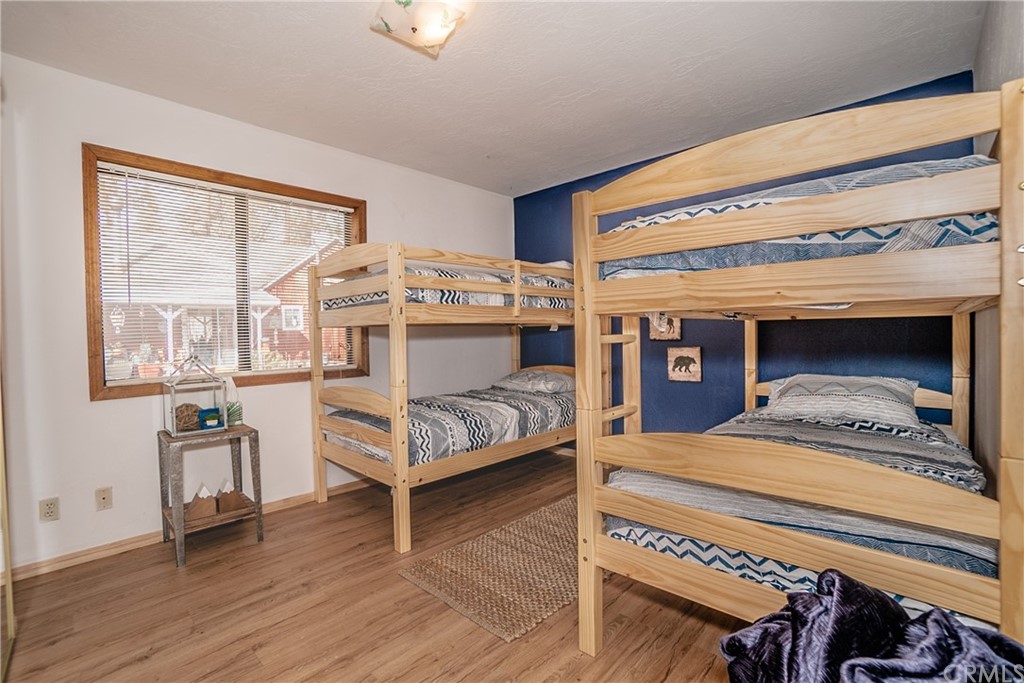 725 Temple Lane Big Bear Lake, CA 92315 - Photo 39 of 65 a bedroom with a bed and a large window