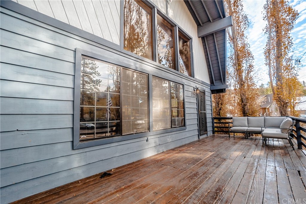 725 Temple Lane Big Bear Lake, CA 92315 - Photo 4 of 65 a view of a house with a large window and wooden floor