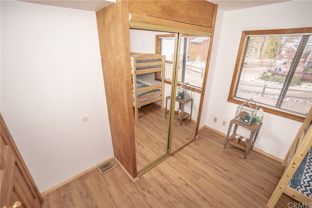 725 Temple Lane Big Bear Lake, CA 92315 - Photo 42 of 65 a view of a hardwood floor and staircase in a room