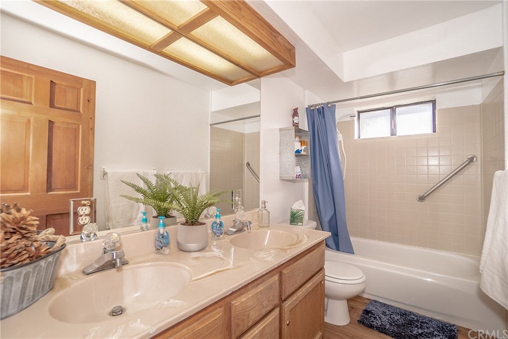 725 Temple Lane Big Bear Lake, CA 92315 - Photo 48 of 65 a bathroom with a granite countertop sink toilet and shower