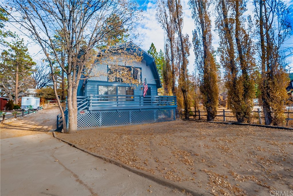 725 Temple Lane Big Bear Lake, CA 92315 - Photo 58 of 65 a view of a large white house with a large tree