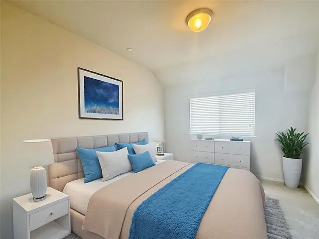 an empty room with a empty space and windows