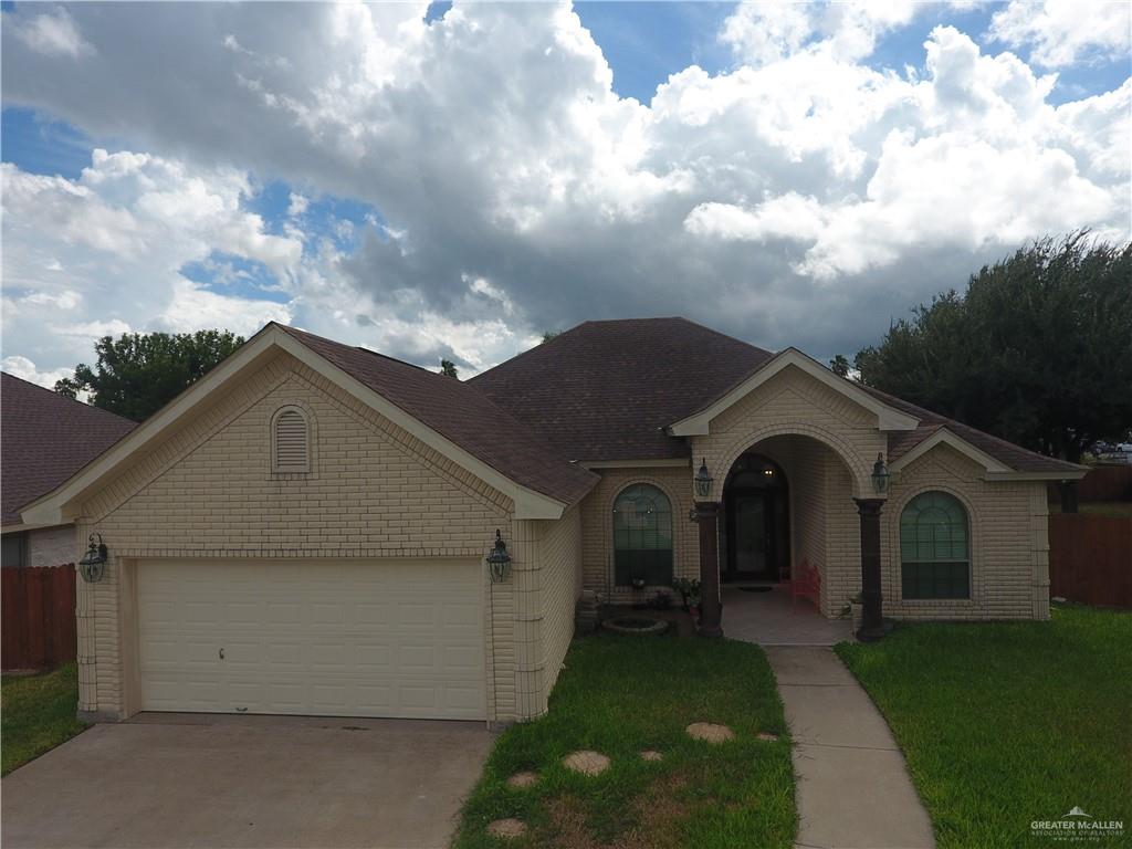 2000 East 25th Street Mission, TX 78574 - Photo 21 of 27 View of front of home with a garage, driveway, and brick siding