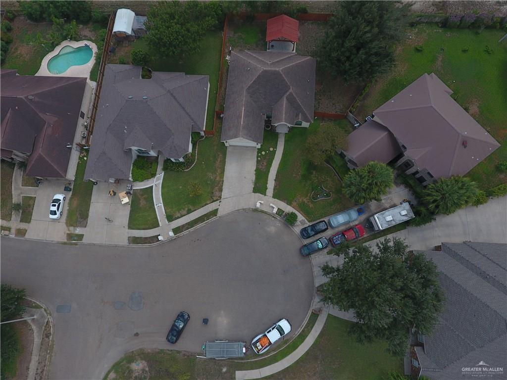 2000 East 25th Street Mission, TX 78574 - Photo 24 of 27 Aerial view of property and surrounding area featuring a pool area and nearby suburban area