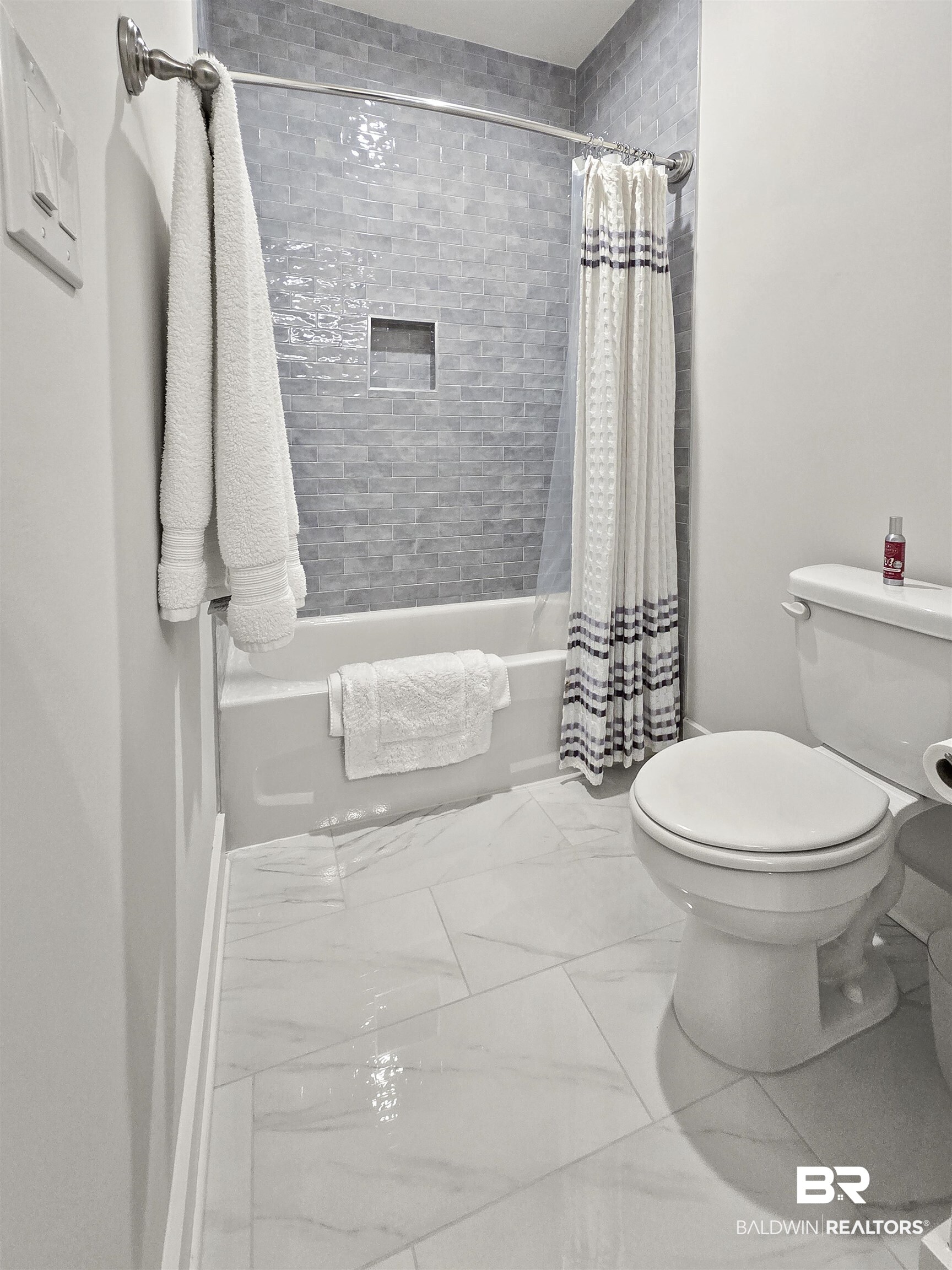 11258 Redfern Road Daphne, AL 36526 - Photo 32 of 44 Full bathroom with shower / bathtub combination with curtain and light marble finish floors