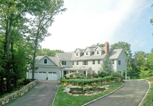 45 Quail Ridge Road Wilton, CT 06897 - Photo 1 of 1 a front view of a house with a yard