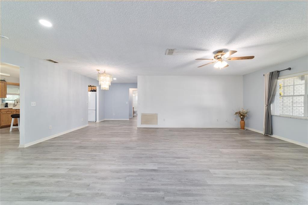 9662 Southwest 97th Lane Ocala, FL 34481 - Photo 15 of 52 a view of empty room with a ceiling fan and window