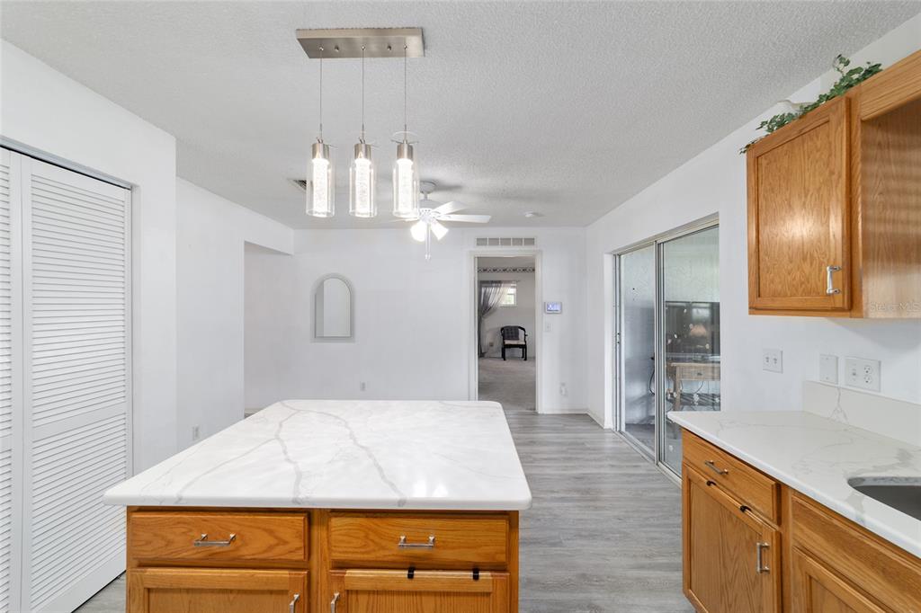 9662 Southwest 97th Lane Ocala, FL 34481 - Photo 26 of 52 a spacious bathroom with a granite countertop sink a mirror and a shower