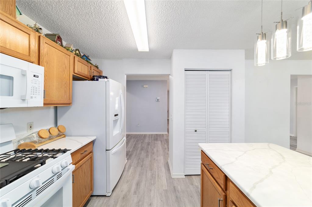 9662 Southwest 97th Lane Ocala, FL 34481 - Photo 28 of 52 a kitchen with a stove and a wooden floor