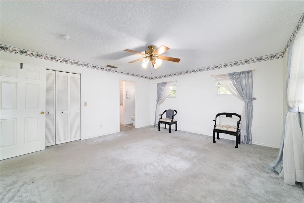 9662 Southwest 97th Lane Ocala, FL 34481 - Photo 31 of 52 a view of a livingroom with a ceiling fan and a window
