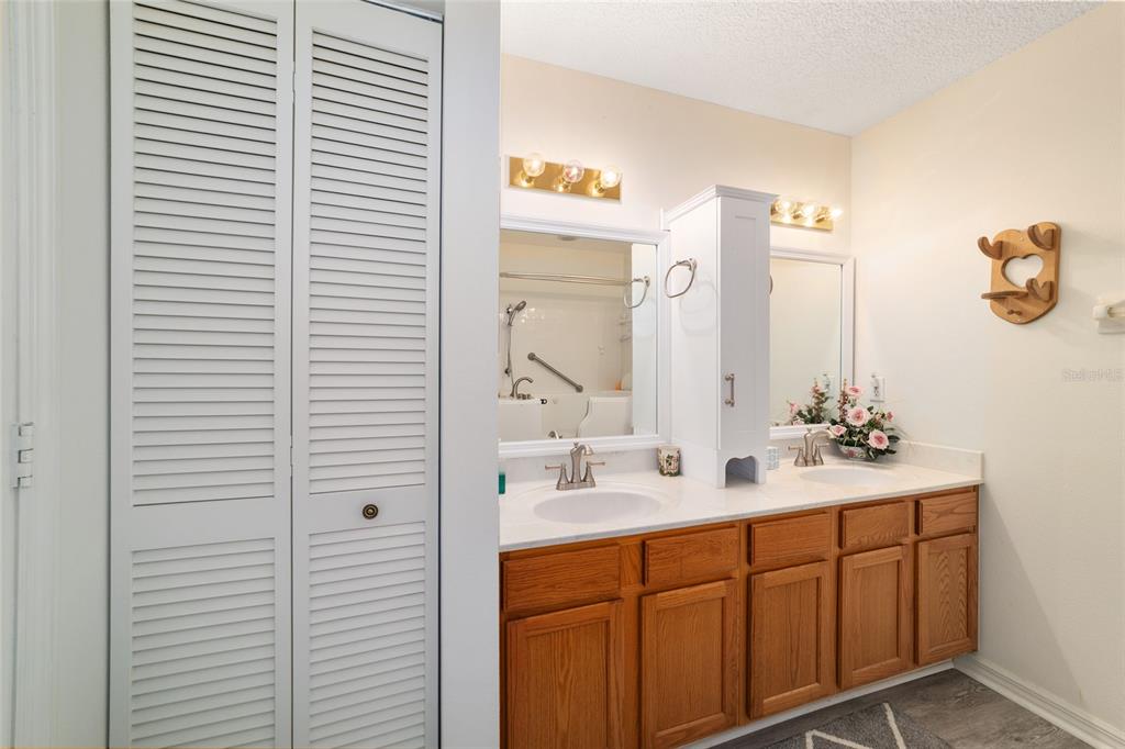 9662 Southwest 97th Lane Ocala, FL 34481 - Photo 35 of 52 a bathroom with a sink and a mirror