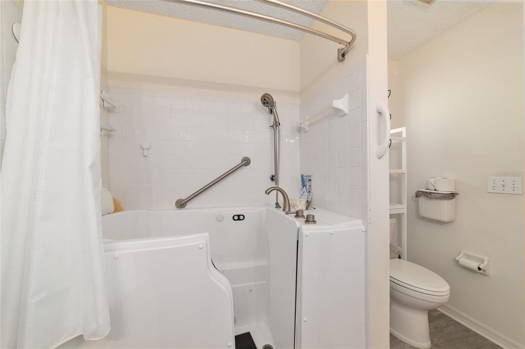 9662 Southwest 97th Lane Ocala, FL 34481 - Photo 36 of 52 a bathroom with a shower and toilet