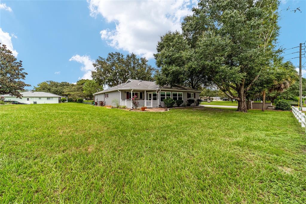 9662 Southwest 97th Lane Ocala, FL 34481 - Photo 52 of 52 a view of a house with a big yard