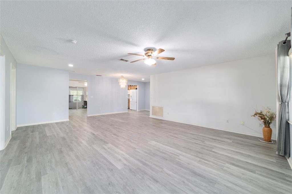 9662 Southwest 97th Lane Ocala, FL 34481 - Photo 8 of 52 a view of an empty room and a ceiling fan window