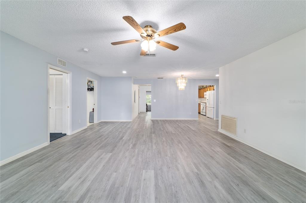 9662 Southwest 97th Lane Ocala, FL 34481 - Photo 9 of 52 a view of an empty room and wooden floor
