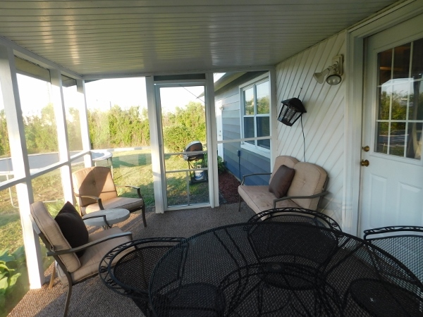100 Southview Drive Rochelle, IL 61068 - Photo 15 of 17 a living room with furniture and a floor to ceiling window