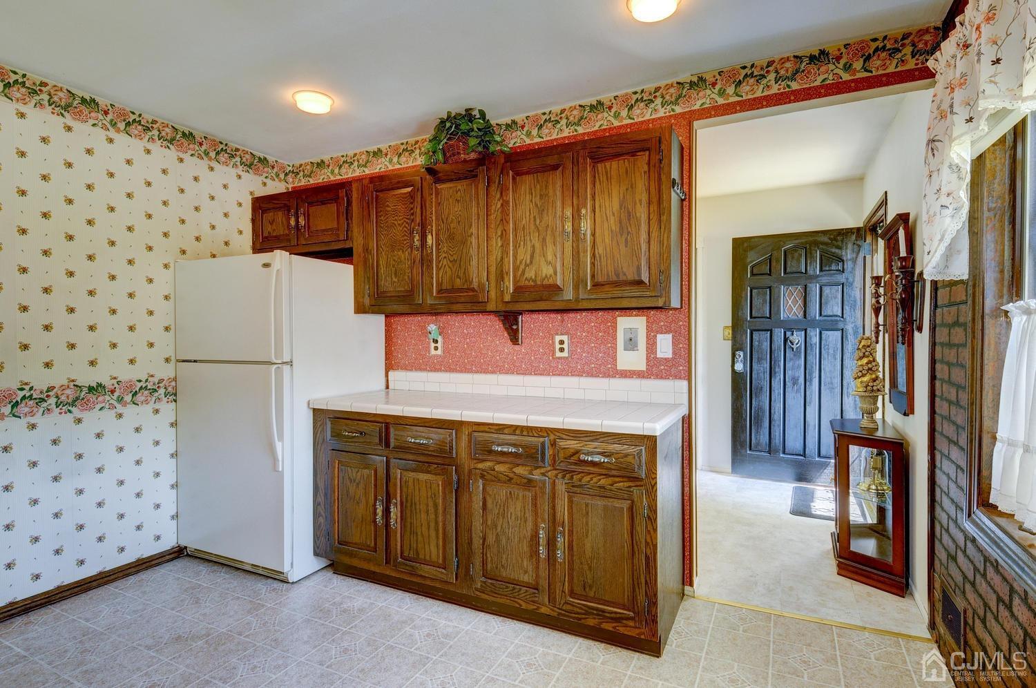 9 Villanova Road Old Bridge, NJ 08859 - Photo 12 of 29 a kitchen with a refrigerator and a sink