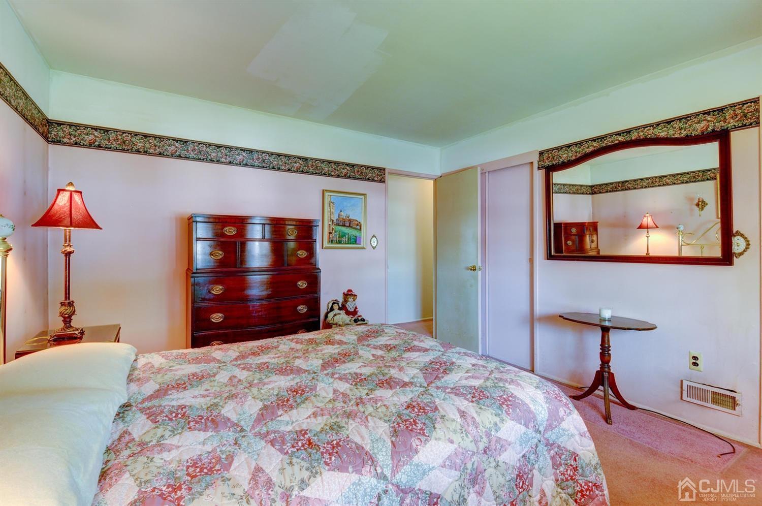 9 Villanova Road Old Bridge, NJ 08859 - Photo 20 of 29 a bedroom with a bed and a mirror