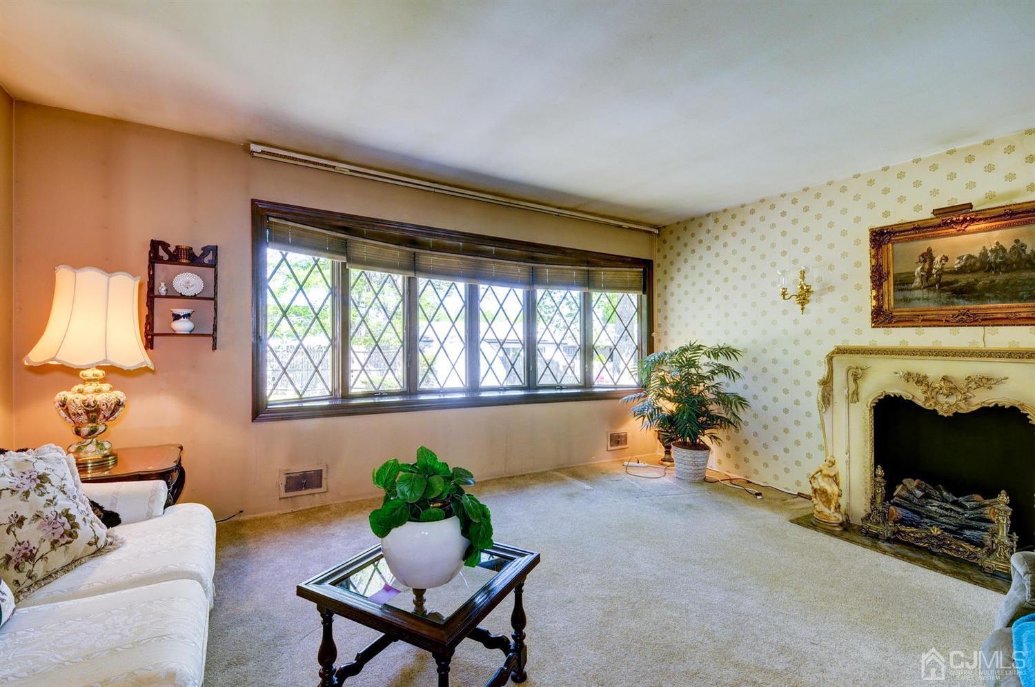 9 Villanova Road Old Bridge, NJ 08859 - Photo 6 of 29 a living room with furniture and a fireplace