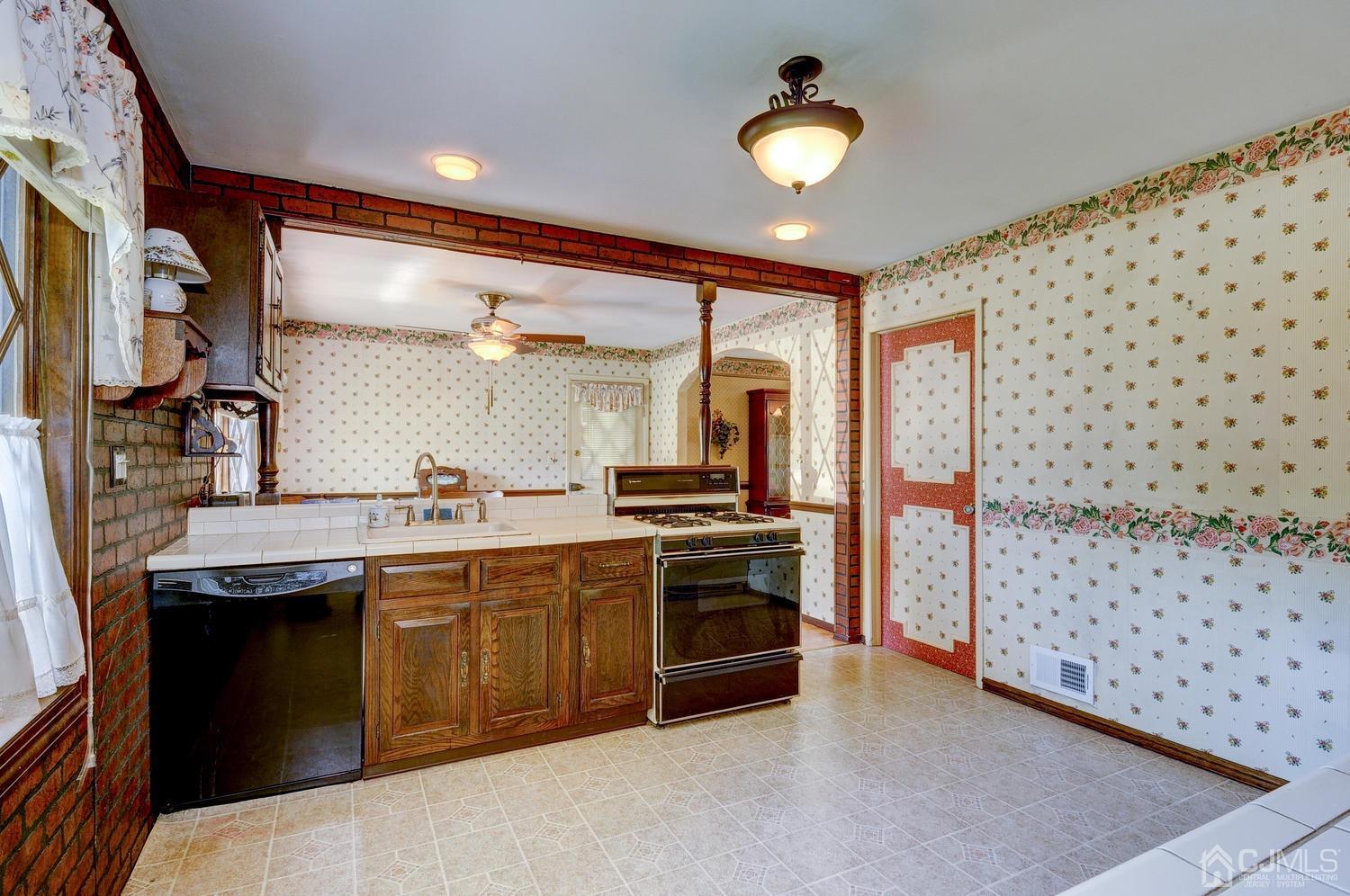 9 Villanova Road Old Bridge, NJ 08859 - Photo 8 of 29 a kitchen with granite countertop a stove a sink and a refrigerator