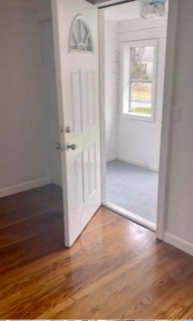 32 Elton Road West Yarmouth, MA 02673 - Photo 13 of 14 an empty room with wooden floor and windows