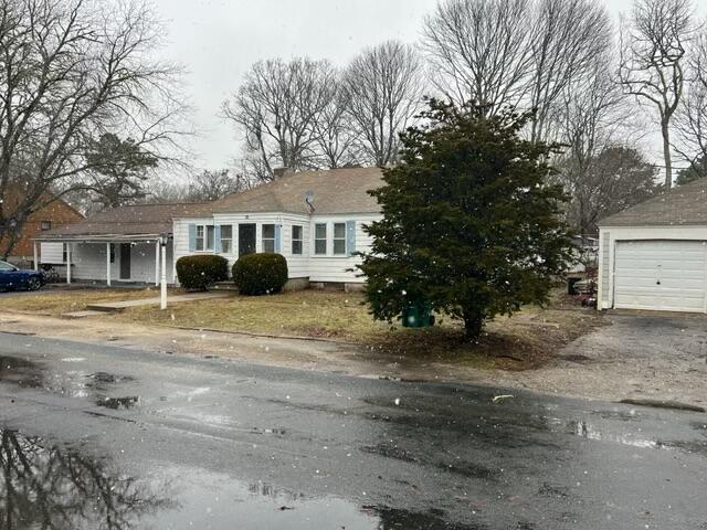 32 Elton Road West Yarmouth, MA 02673 - Photo 14 of 14 a front view of a house with a garden