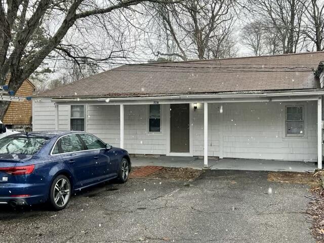 32 Elton Road West Yarmouth, MA 02673 - Photo 4 of 14 a view of a car parked in front of a house