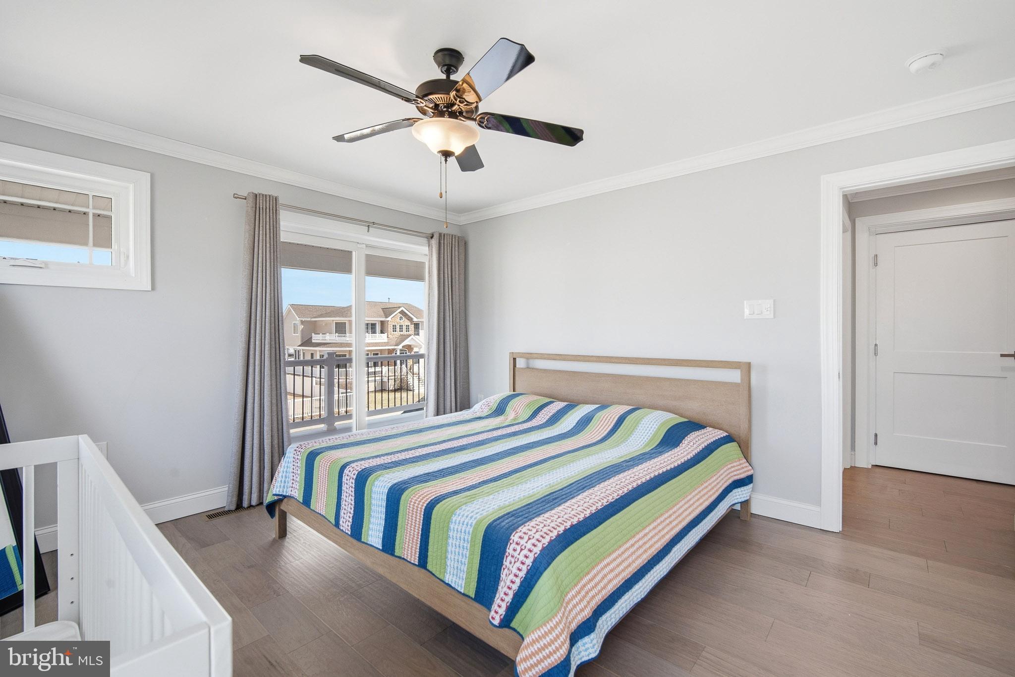 2500 Bayshore Avenue Brigantine, NJ 08203 - Photo 18 of 62 a bedroom with a bed and a large window