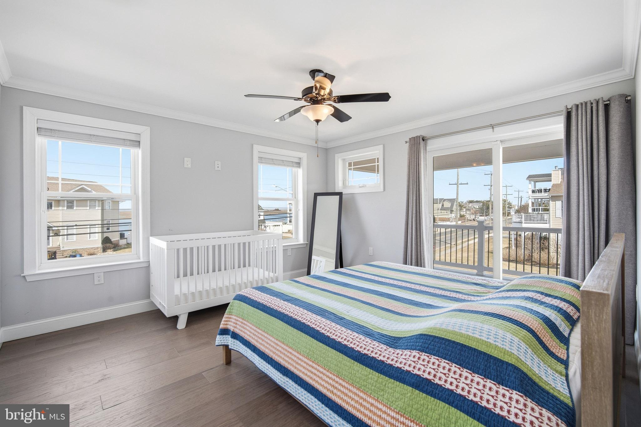 2500 Bayshore Avenue Brigantine, NJ 08203 - Photo 19 of 62 a bedroom with a bed and a large window