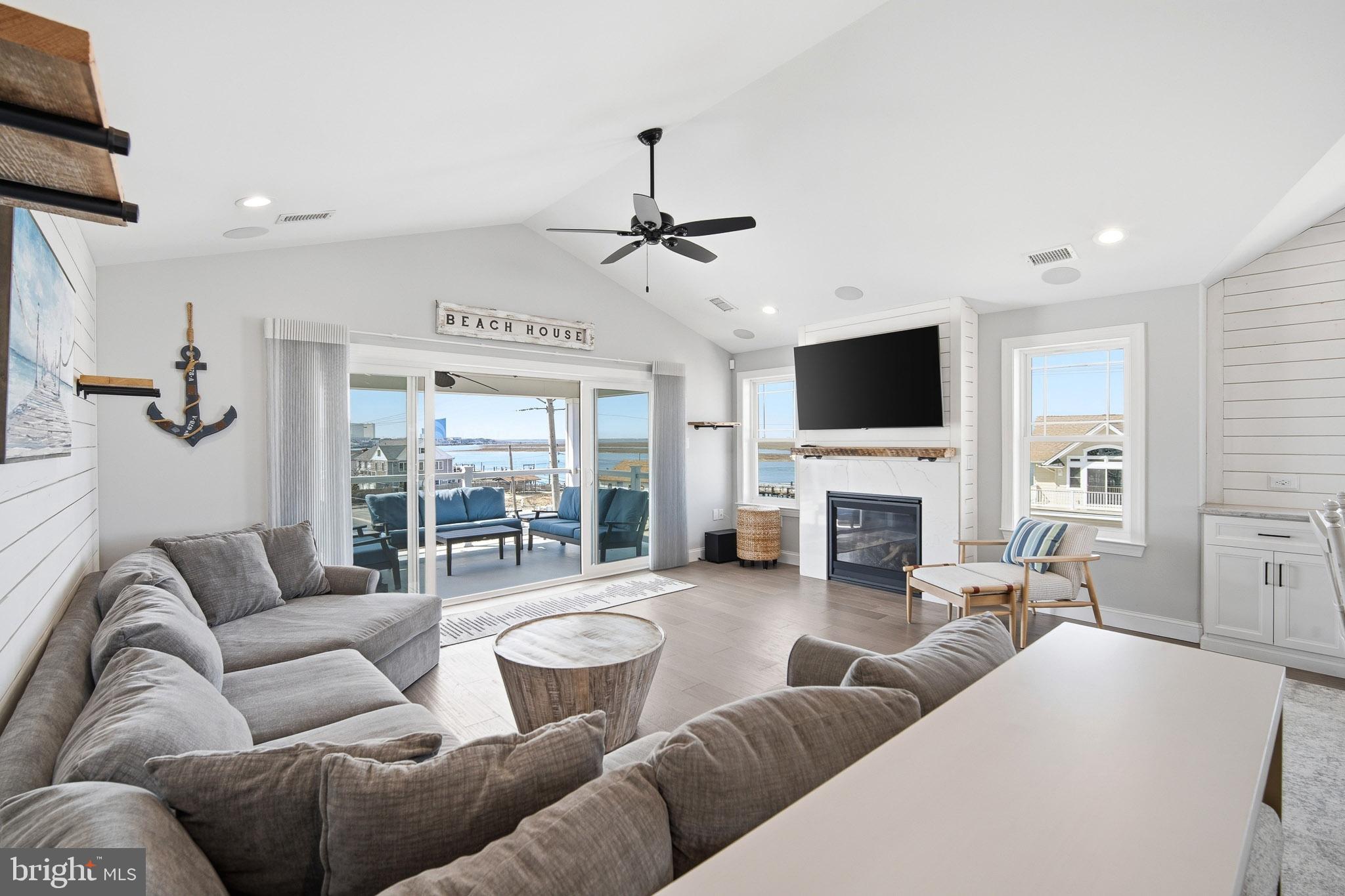 2500 Bayshore Avenue Brigantine, NJ 08203 - Photo 28 of 62 a living room with fireplace furniture and a flat screen tv