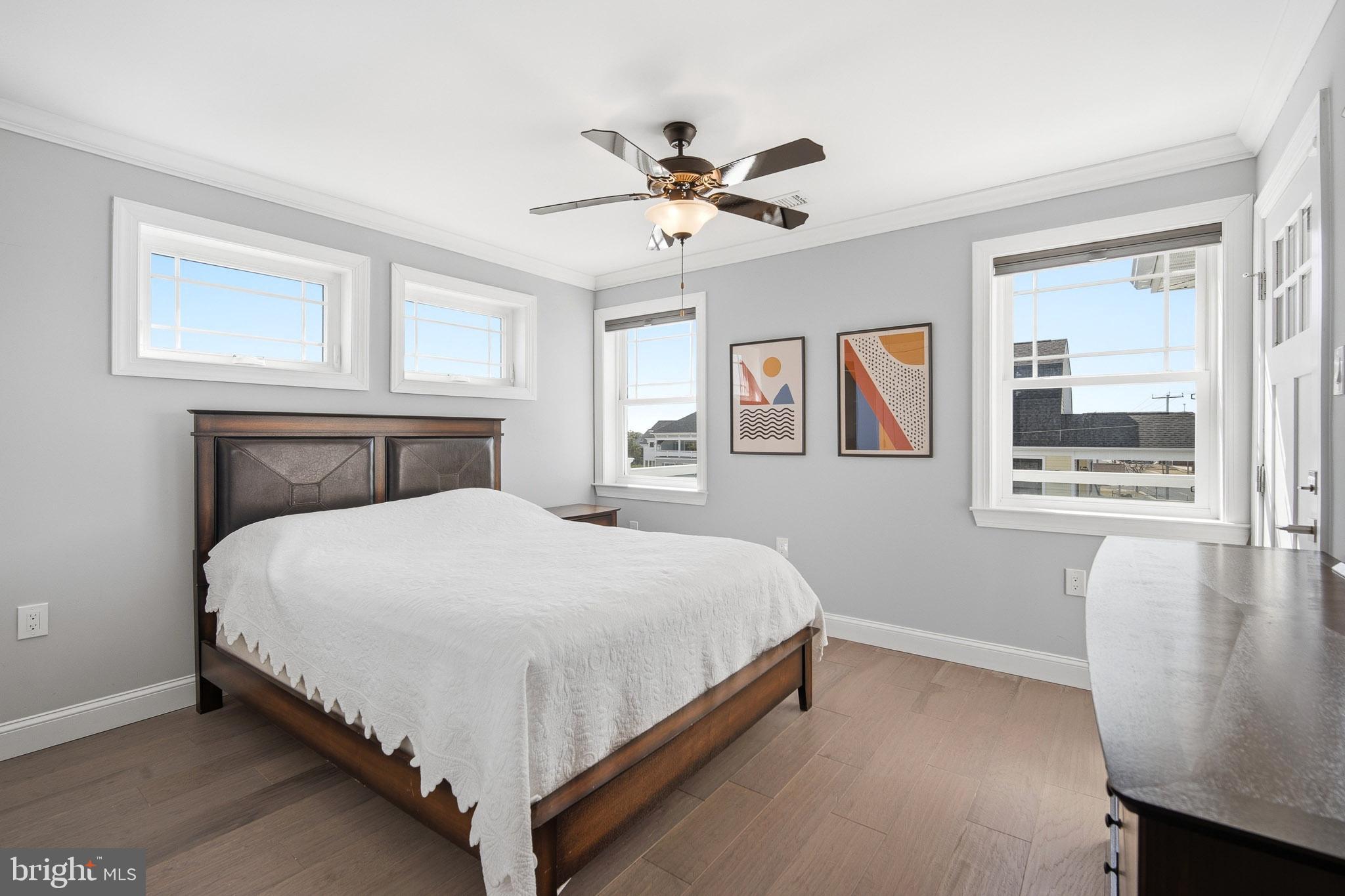 2500 Bayshore Avenue Brigantine, NJ 08203 - Photo 37 of 62 a bedroom with a large bed and a window