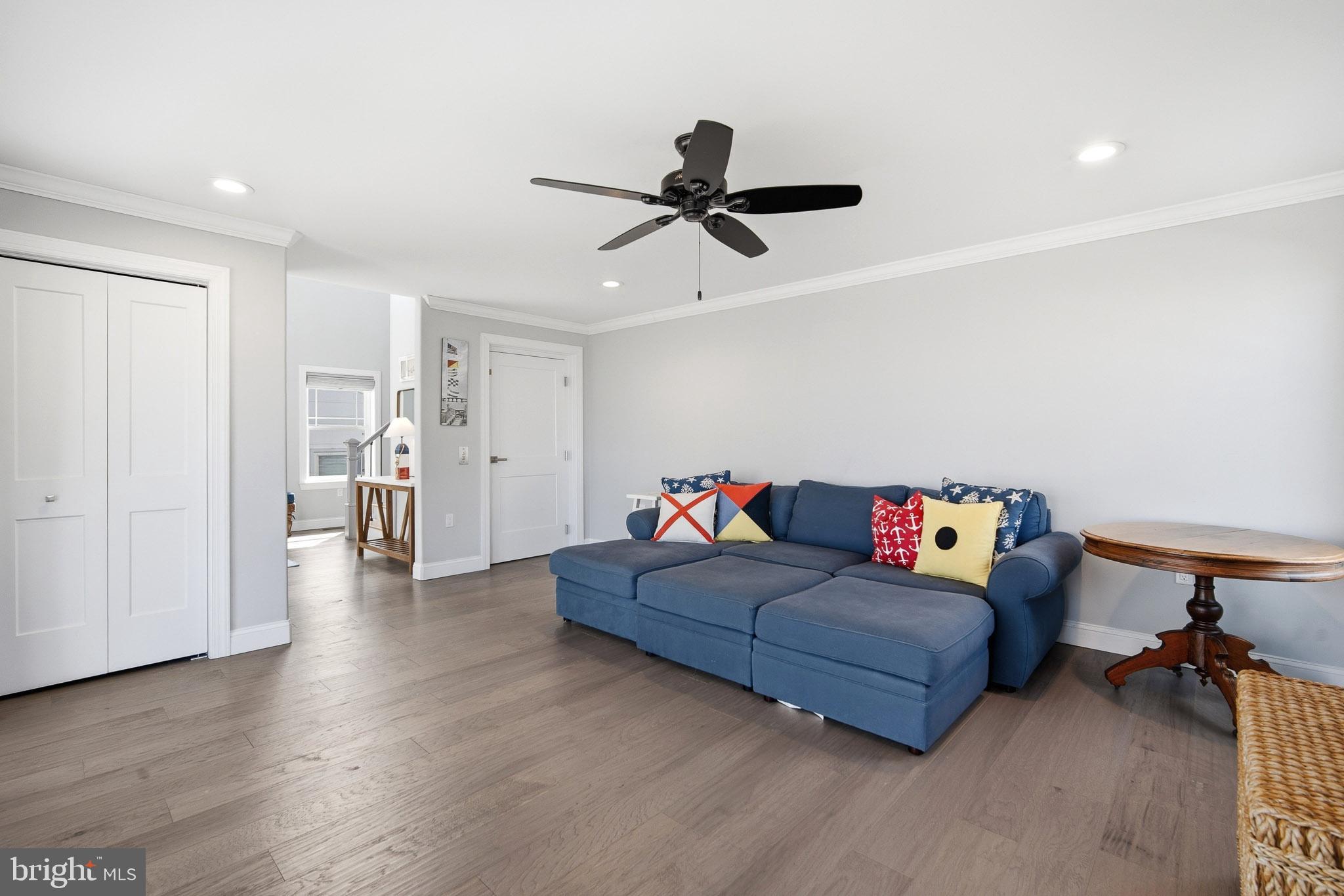 2500 Bayshore Avenue Brigantine, NJ 08203 - Photo 4 of 62 a living room with furniture and a ceiling fan