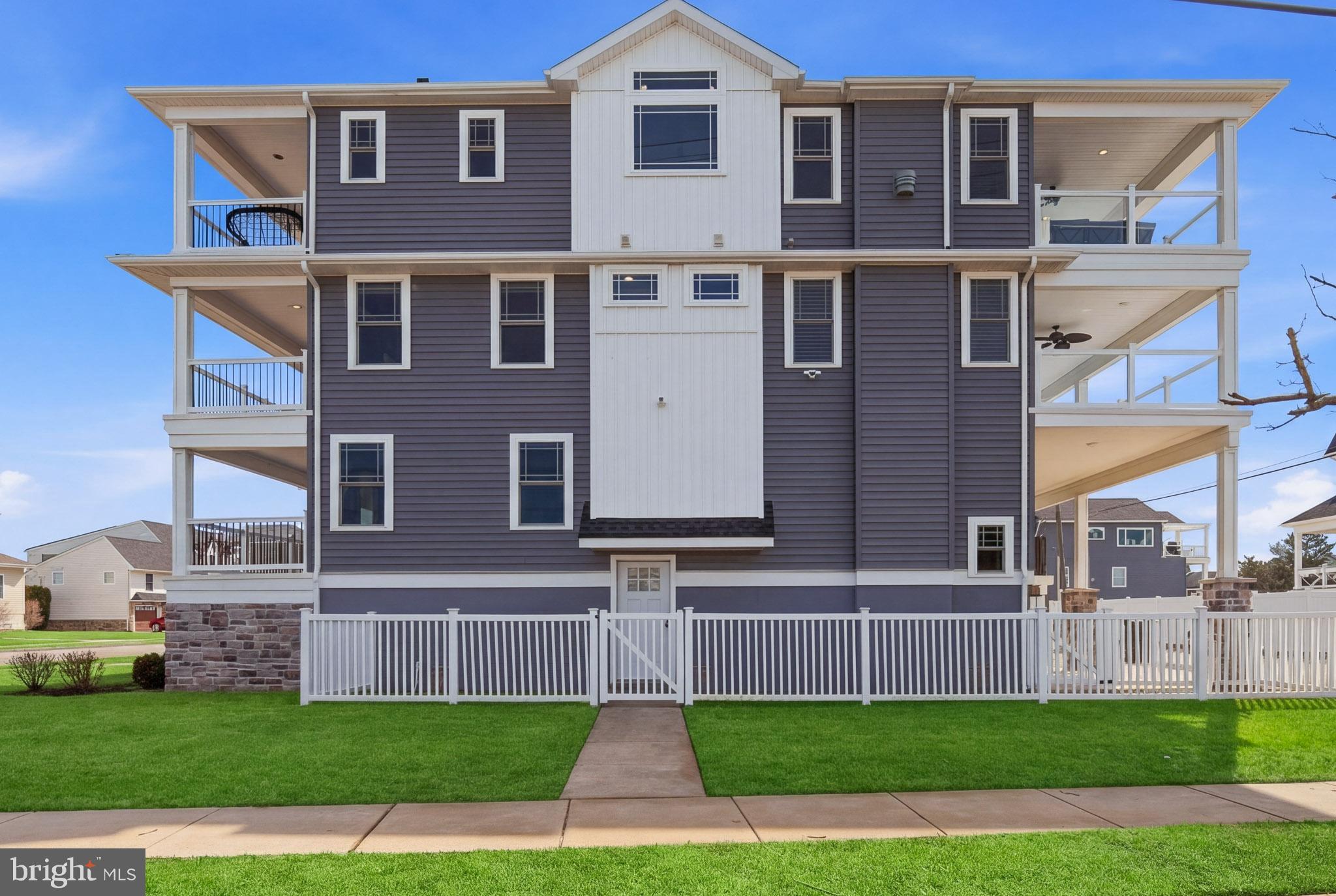 2500 Bayshore Avenue Brigantine, NJ 08203 - Photo 43 of 62 a front view of a house with a yard