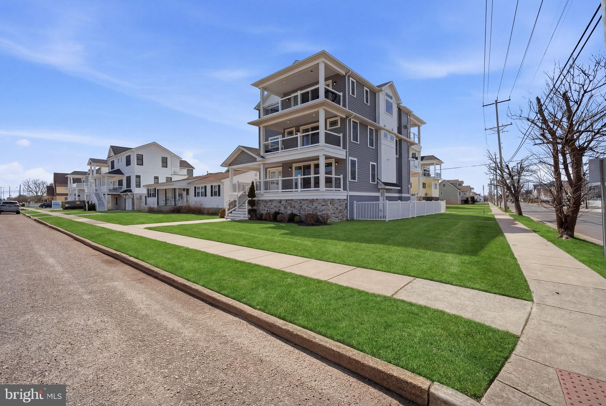 2500 Bayshore Avenue Brigantine, NJ 08203 - Photo 44 of 62 a view of a big building with a big yard and large trees