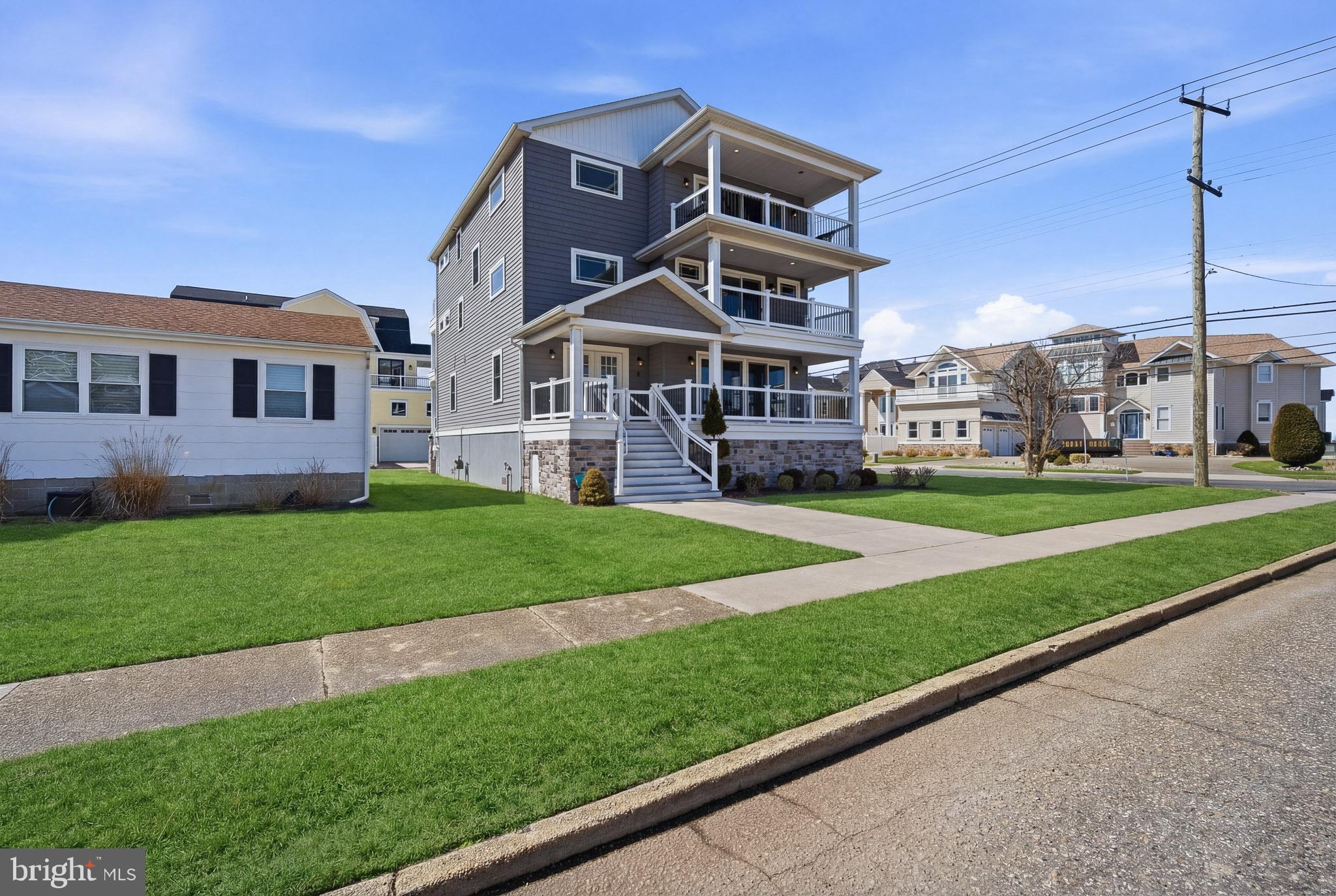 2500 Bayshore Avenue Brigantine, NJ 08203 - Photo 45 of 62 a front view of a house with a yard