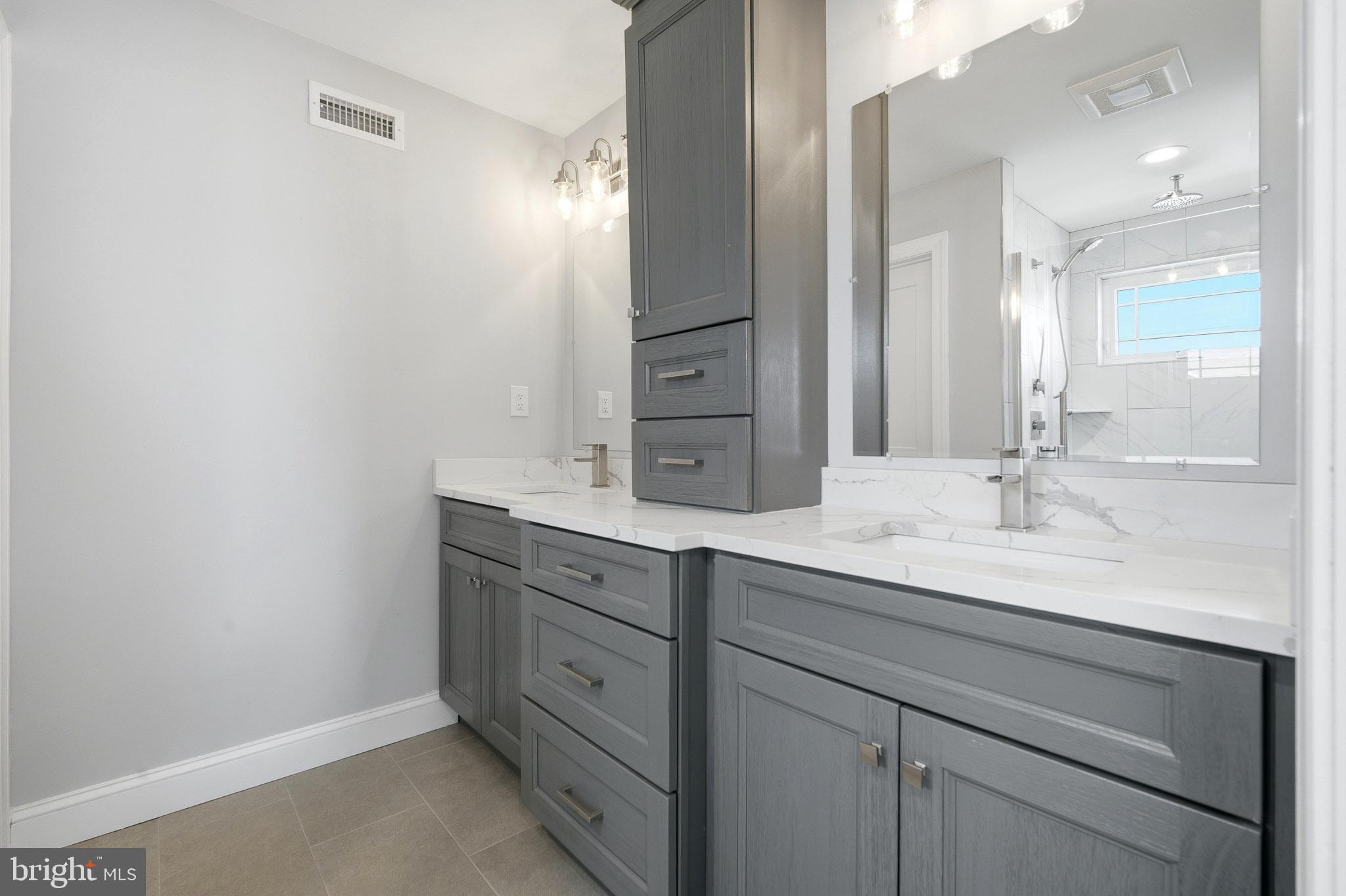 2500 Bayshore Avenue Brigantine, NJ 08203 - Photo 10 of 62 a bathroom with a sink and a mirror