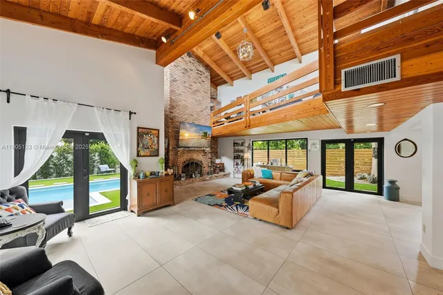 a view of a porch with furniture and a large window