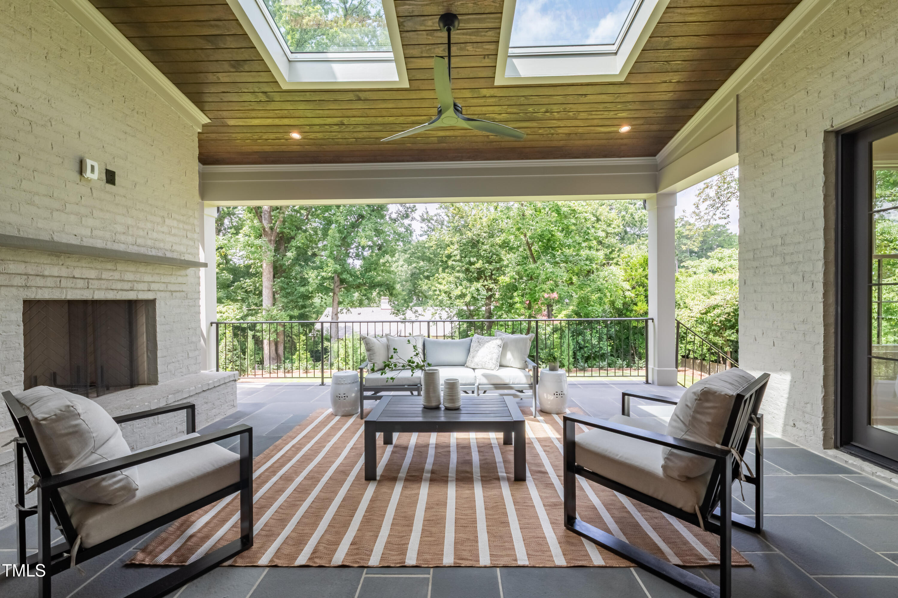 2227 Wheeler Road Raleigh, NC 27607 - Photo 49 of 56 a view of a patio with chairs and a table