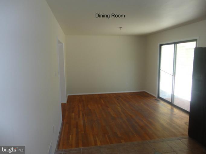 12803 Broadmore Road Silver Spring, MD 20904 - Photo 1 of 11 a view of a room with wooden floor and window