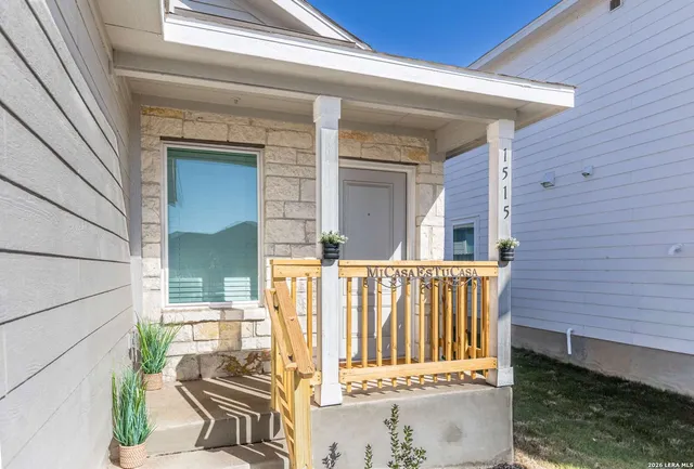 a view of a balcony with wooden floor