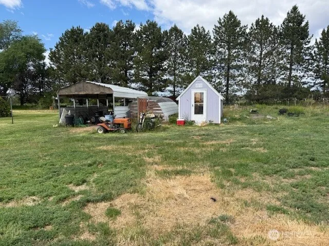 a view of a backyard with sitting area and furniture