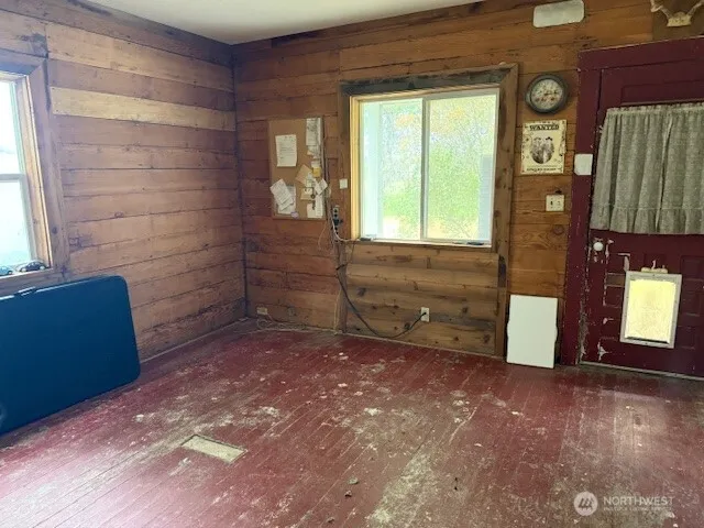 a view of an empty room with a window